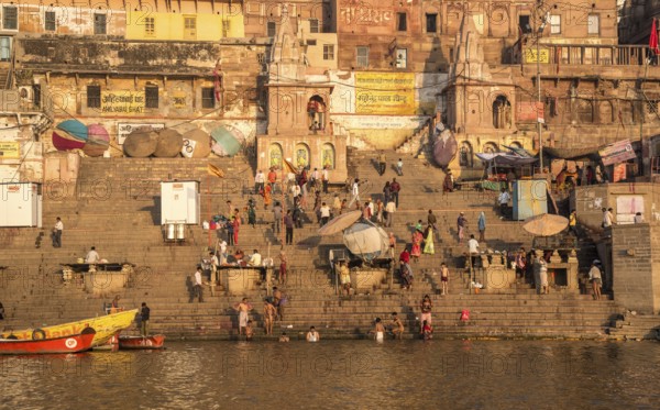 Varanasi, India, March 13 2017: India people at the ghats and riverbank of sacred Ganges river for