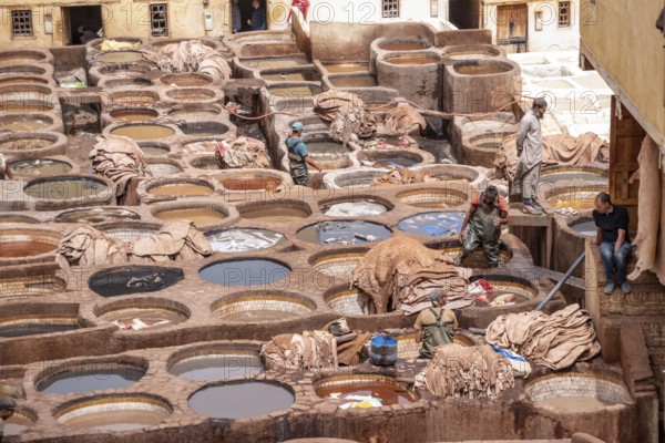 FES, MOROCCO, ARIL 10, 2023, Famous tannery in the medina of Fes, where leather is being processed