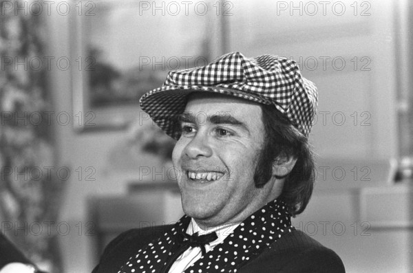 Elton John. English singer, songwriter born march 25 1947. Pictured wearing a chequered cap and a