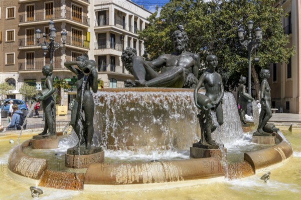 Turia Fountain (Font Del Túria) with a large sculpture of the Turia Man in the centre, surrounded