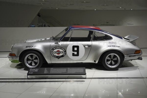 Porsche 911 Carerra RSA silver Porsche 911 on display in the museum with Martini Racing design, New