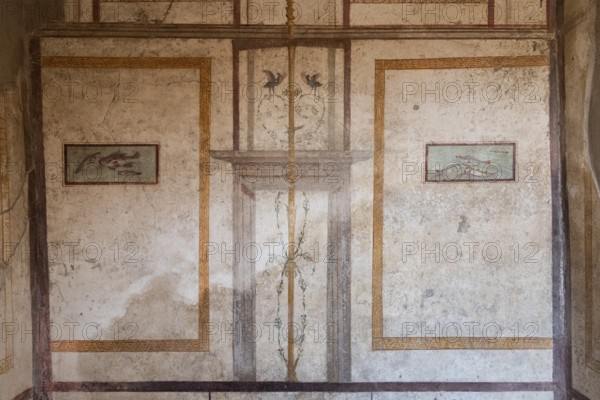 POMPEII, ITALY, MAY 04, 2022, Scenic ancient frescoes in a room of a Pompeiian villa, Southern