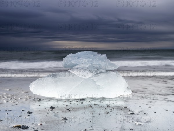 Diamond Beach, iceberg in the surf on the black lava beach, near Jökulsarlon glacier lagoon,