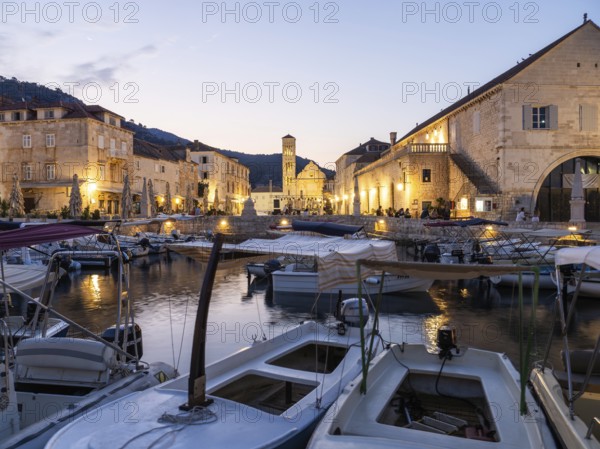 Morning atmosphere, boats in the old harbour, St. Stephen's Cathedral in the background, town of