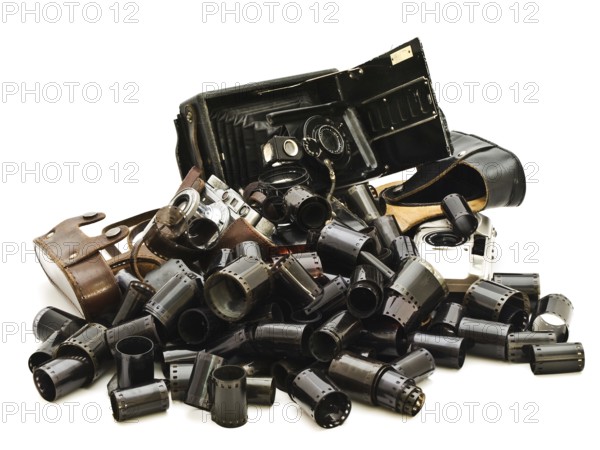 Retro Photo Accessory With Many Films And Vintage Cameras Against The White Background Daugavpils,