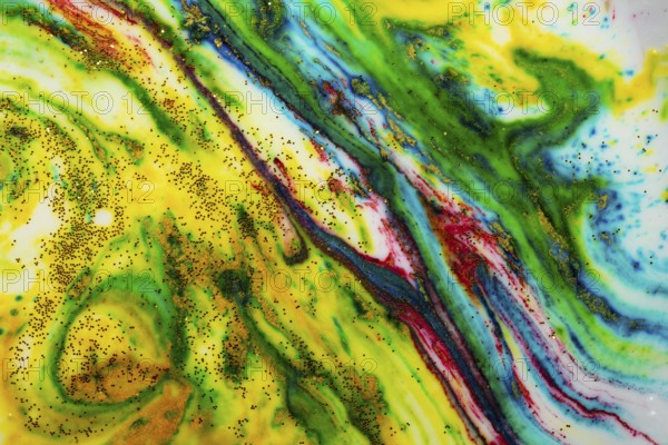 Multicoloured background of bright colours covered with gold sparkles
