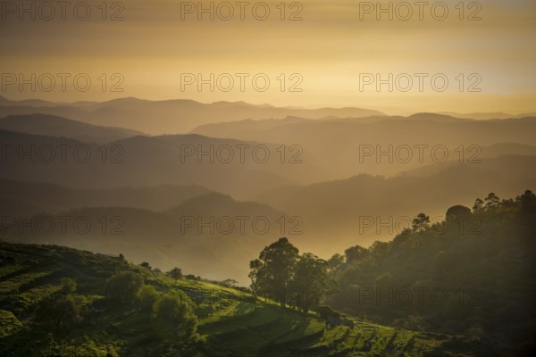 Sunset valley view with terraced fields of Serra de Monchique near mount Foia in the Algarve region