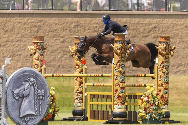 Conor Swail, from Ireland and riding Casturano, compete in the 1.60m Grand Prix during The