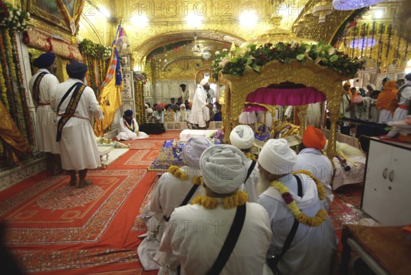Sikh clerics sitting, celebrations consecration of perpetual Guru Granth Sahib Sikh, Sachkhand