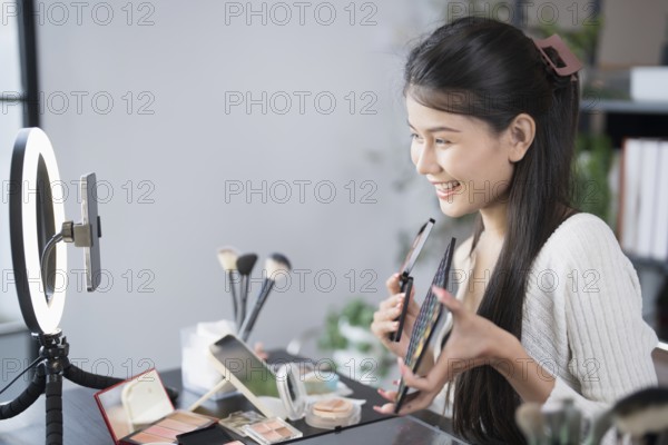 Beauty blogger Young Asian girl makeup artist Professional Woman blogger vlogger is showing