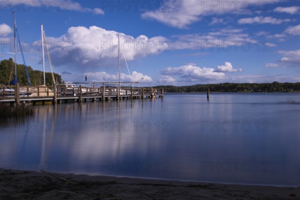 View over the Scharmützelsee with jetty and marina, long exposure, Wendisch-Rietz, Brandenburg,