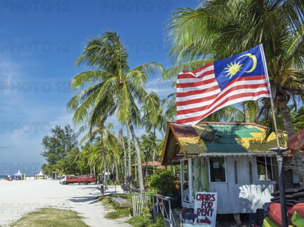 Beach hut with flag, on the sandy beach, Chenang Beach, Langkawi, Kedah State, Malaysia, Southeast