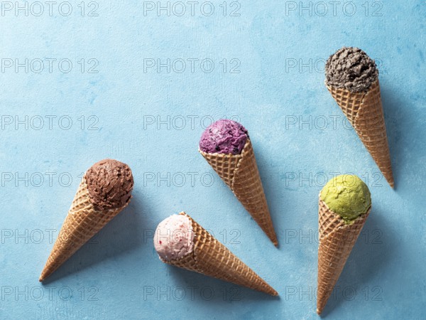 Various ice cream scoops in cones with copy space. Colorful ice cream in cones chocolate,