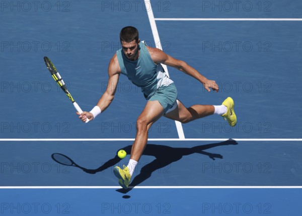 Spanish tennis player Carlos Alcaraz (ESP) playing forehand shot at Australian Open 2025