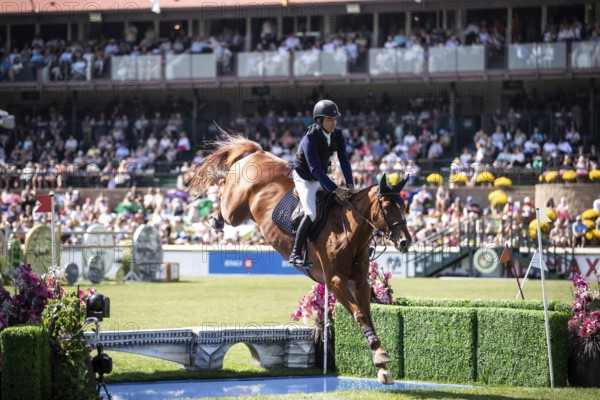 Juan Manuel Gallego of Columbia and riding Fee Des Sequoias Z compete in the first round of the 1