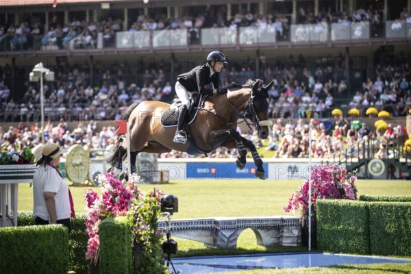 Katie Laurie of Australia and riding Django II compete in the first round of the 1.60m CPKC