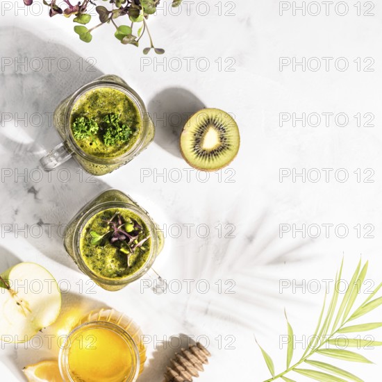 Food, Green detox cocktails in two cans, standing on a white table, top view, healthy lifestyle