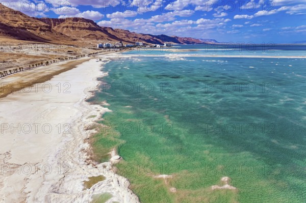 Magnificent Dead Sea. Drone footage. Bright March day. The water reflects the bright blue of the