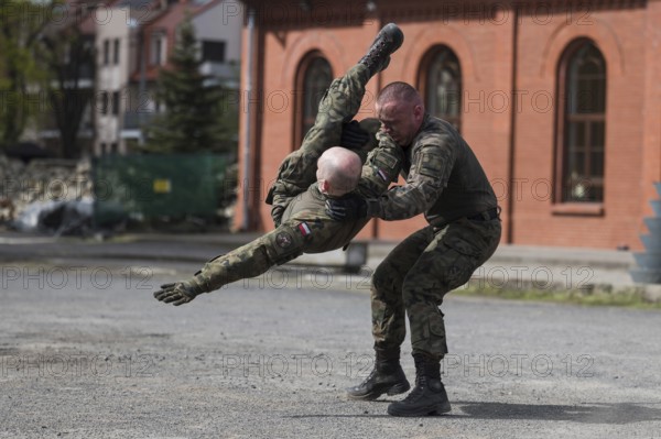LEGNICA, POLAND, APRIL 26, 2023: Military picnic as part of the Cyber Mil Academy program. Hand to