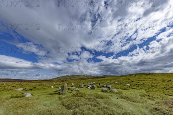 Druids Circle, stone circle in wide landscape with pastures in the mountains, Penmaenmawr,