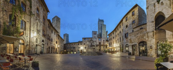 Panoramic view of famous Piazza della Cisterna in the historic town of San Gimignano on a morning,