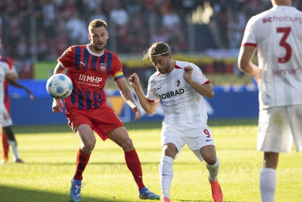Football match, Lucas HÖLER SC Freiburg right, heads the ball and keeps an eye on it together with