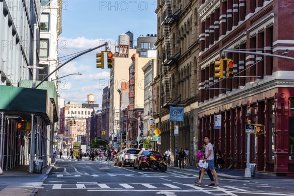 New York City, USA, June 25, 2018: Street with luxury fashion retail stores in Soho Cast Iron