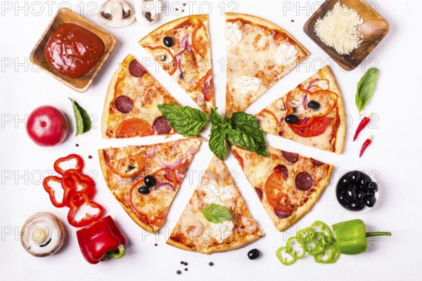 Selection of Assorted pieces pizza on white background and ingredients. Pepperoni, Vegetarian and