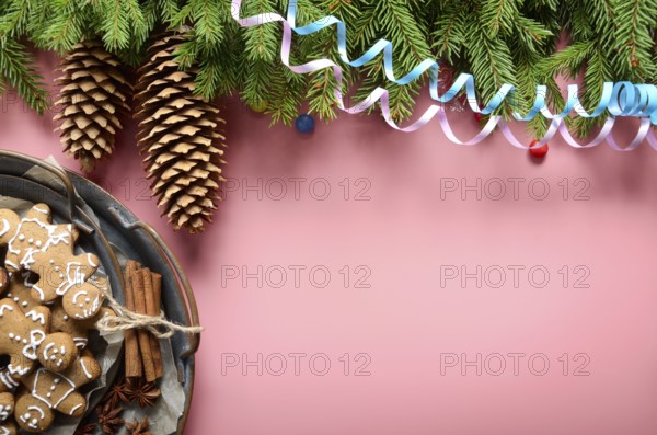 Flat lay design of Christmas greeting card of fir twigs cones party streamer and vintage metal tray