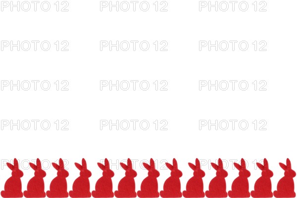 Red Easter bunnies in a row - isolated on white background Row of red easter bunnies - isolated on