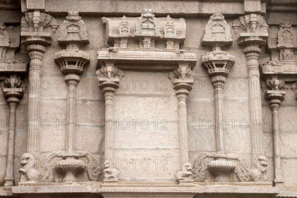 Richly relief stone carved pillars and mandapam on the wall of south gopuram of Shree Meenakshi