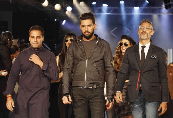 Indian cricket player Yuvraj Singh fashion designers Shantanu Nikhil walks ramp launch clothing