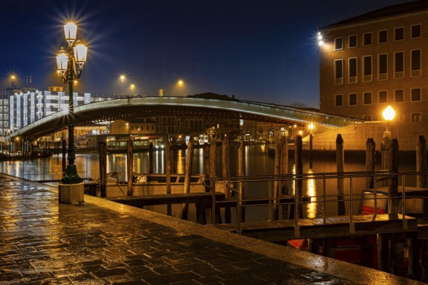 Illuminated bridge over the Grand Canal with lanterns and jetties at night, Fondamenta S. Simeon