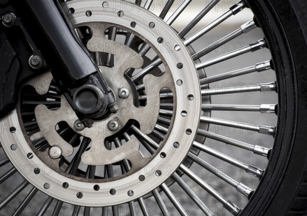 Motorbike front wheel close-up, outdoor on street. bike riding. Close up front wheel of a