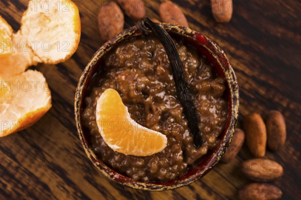 A bowl of chocolate tapioca pudding with fruits