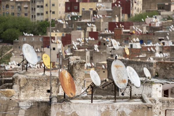 Satellite dishes on the rooftops of residential houses in the medina of Fes, Morocco