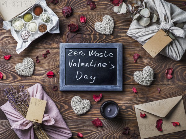 Zero waste Valentine's Day concept. Eco-friendly gift cloth wrapping in Furoshiki style, homemade