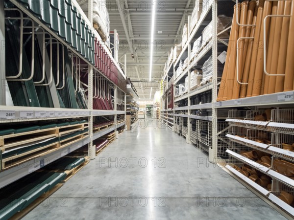 Store for home improvement and DIY. Warehouse aisle of building materials in industiral store.