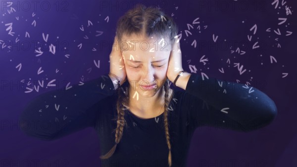 Teenage girl dressed casual with pigtails, being attacked by social media, creating emotional