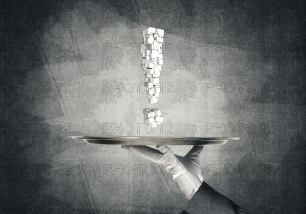 Cropped image of waitress's hand in white glove presenting multiple cubes in form of exclamation