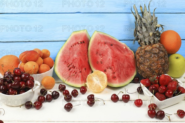 Summer berries and fruits on wooden background, healthy natural food concept, breakfast with