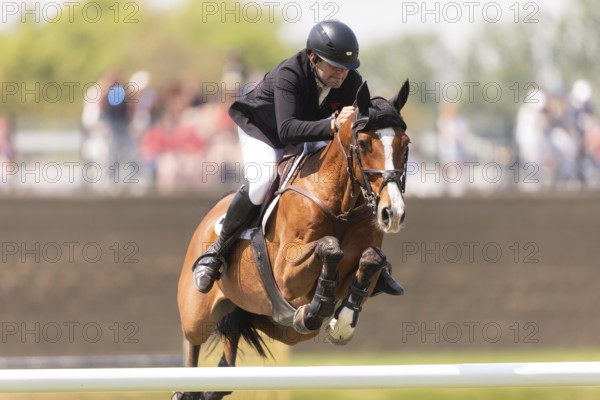 Charlie Jones of Great Britain and riding Capitale 6, compete in the 1.60m Grand Prix during The