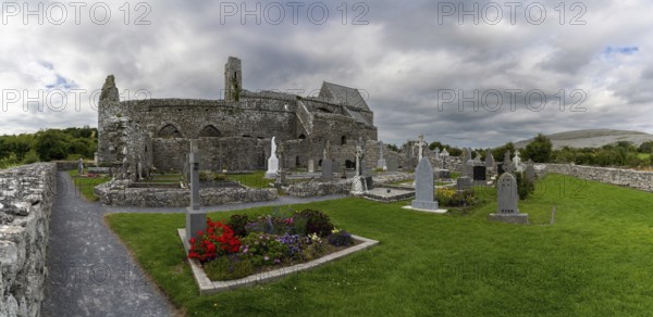 Ballyvaughan, Ireland, 28 July, 2022: panorama view of the historic 13th-century Corcomroe Abbey