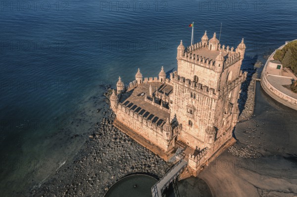 Aerial image of Belem tower, Lisbon, Portugal at summer day. Medieval fortification on Tagus river
