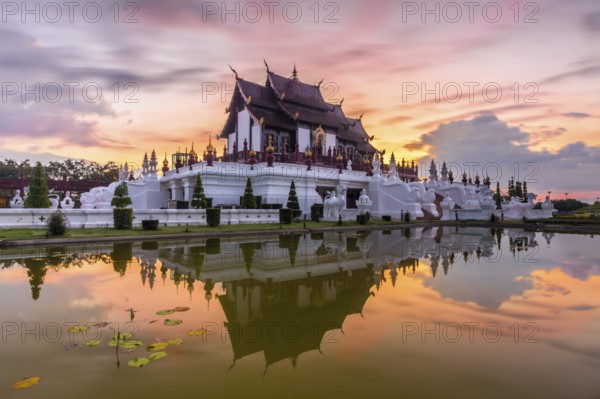 Royal Pavilion and its reflection in pond at Royal Flora Ratchaphruek park. Colorful sky in the
