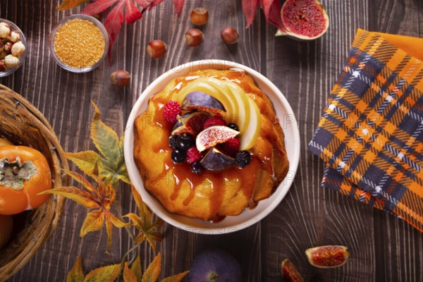 Delicious homemade autumn cake with figs and frozen berries for celebrating Thanksgiving day or