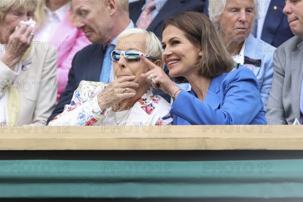 Martina Navratilova and her partner Julia Lemigova watching the action at the 2024 Wimbledon