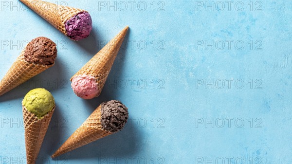 Various ice cream scoops in cones with copy space. Colorful ice cream in cones chocolate,