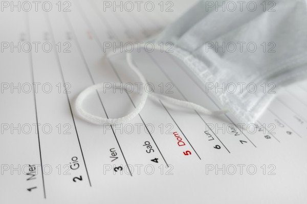 Montly calendar with self protection face mask. Coronavirus concept. Beginning / end of the