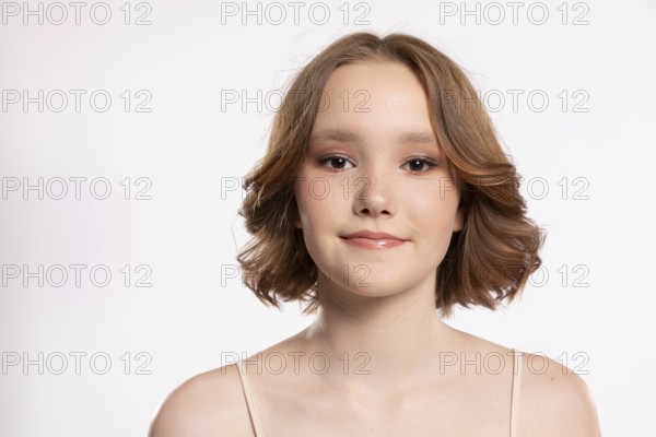 A captivating portrait of a stunning young woman with wavy hair, showcasing her confidence and